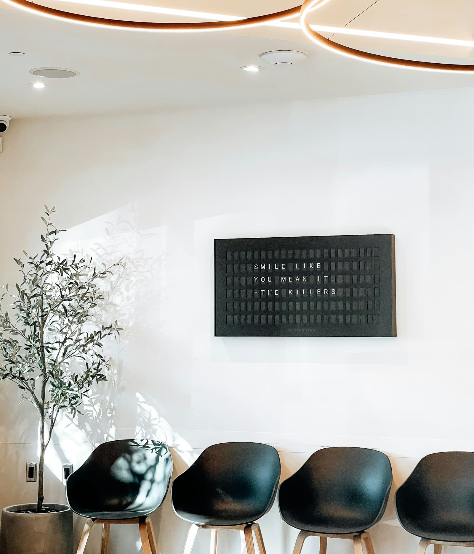 A bright, calm clinic waiting room with chairs